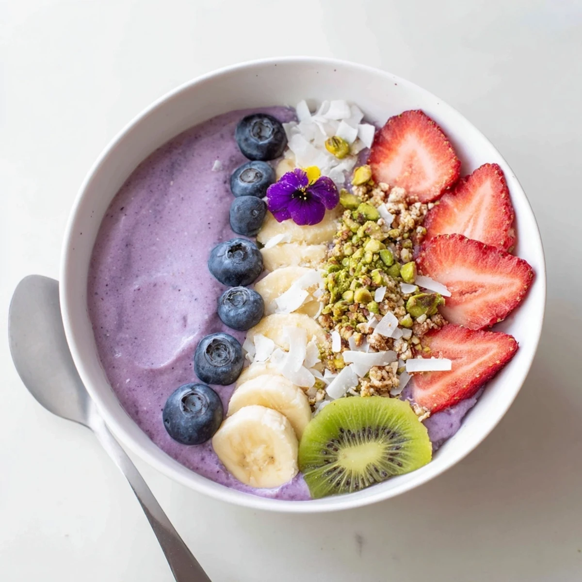 Colorful, creamy smoothie bowls featuring purple yam and banana for a nutritious start.  