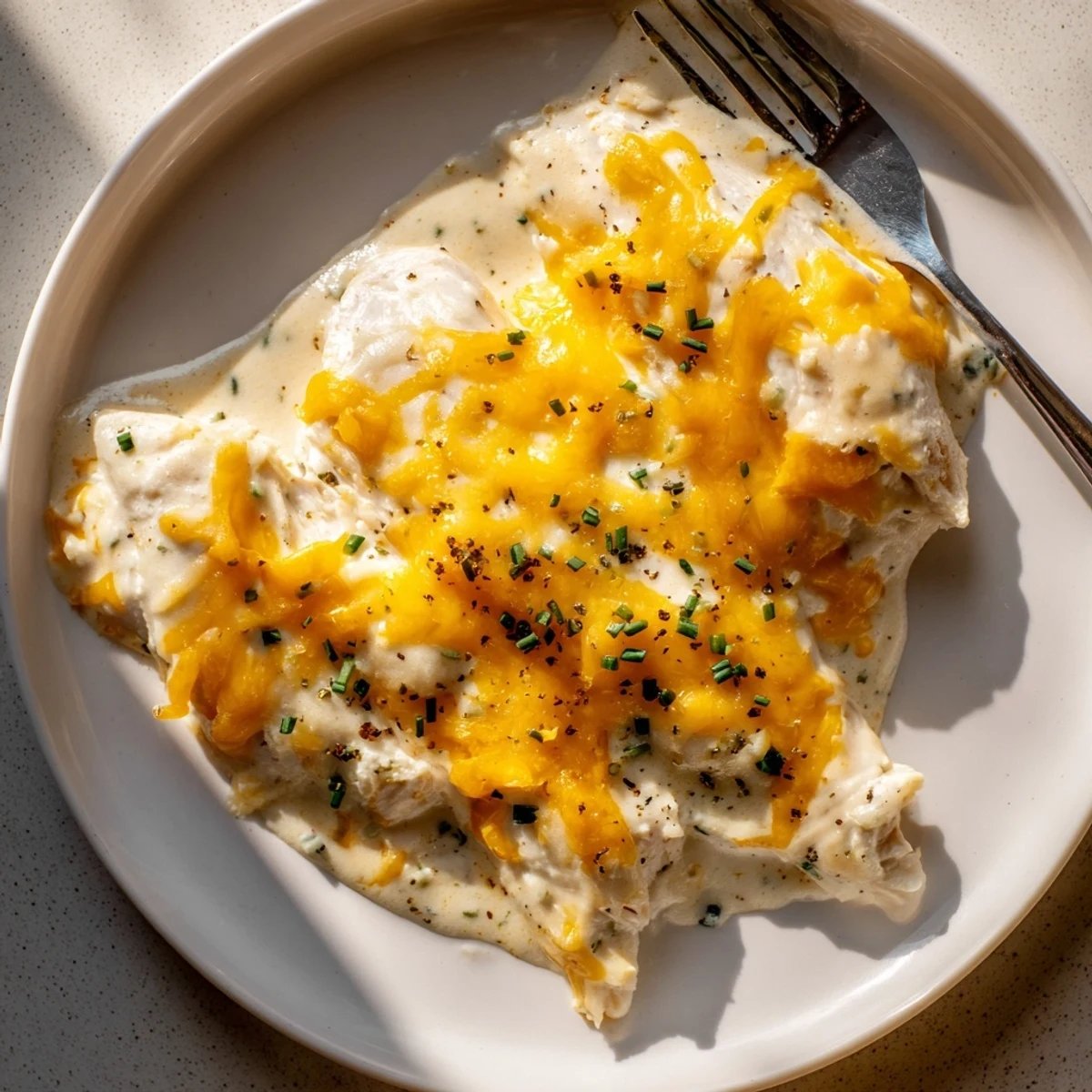Creamy Cheddar Ranch Chicken Bake topped with melted cheese, a comforting weeknight dinner.  