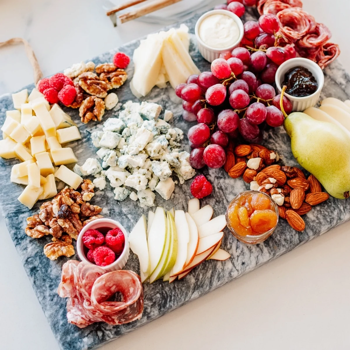 Lace & Pearls Elegant Board with creamy Brie next to colorful fruits, perfect for an upscale gathering.