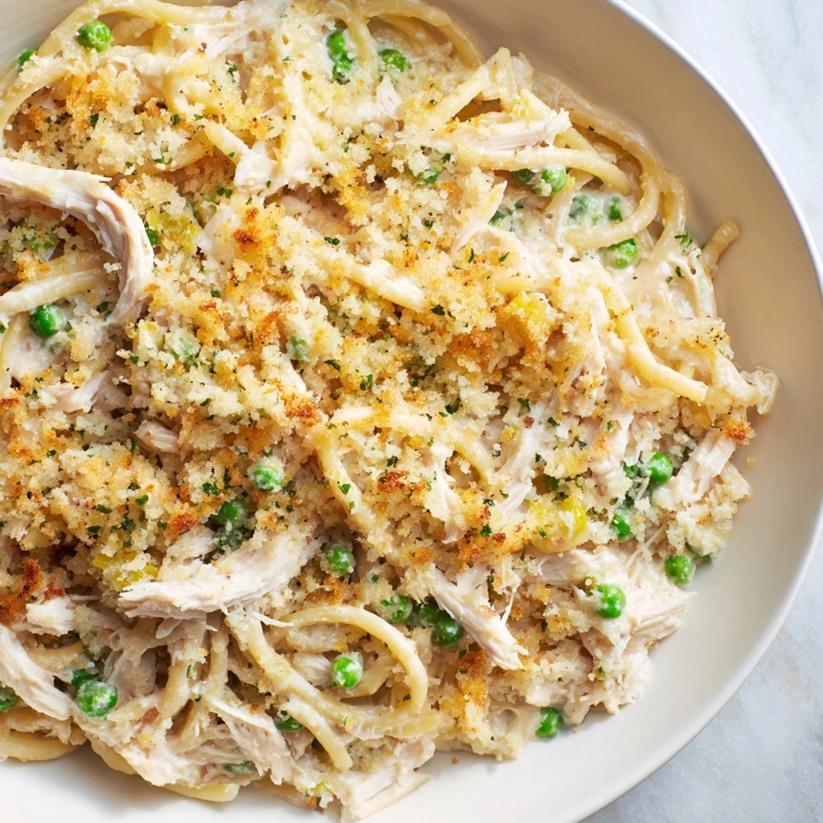 Turkey or Chicken Tetrazzini bake topped with golden, bubbly cheese, perfect for comfort food.