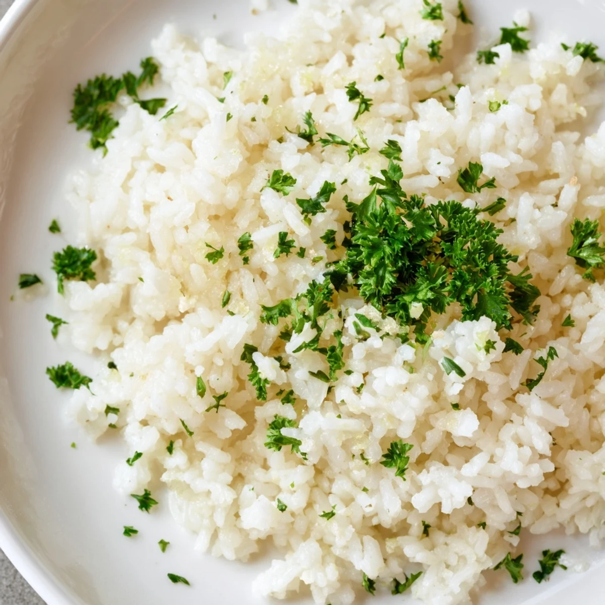 Fluffy, golden Garlic Butter Rice, ready to serve and pairing perfectly with grilled chicken or fish.