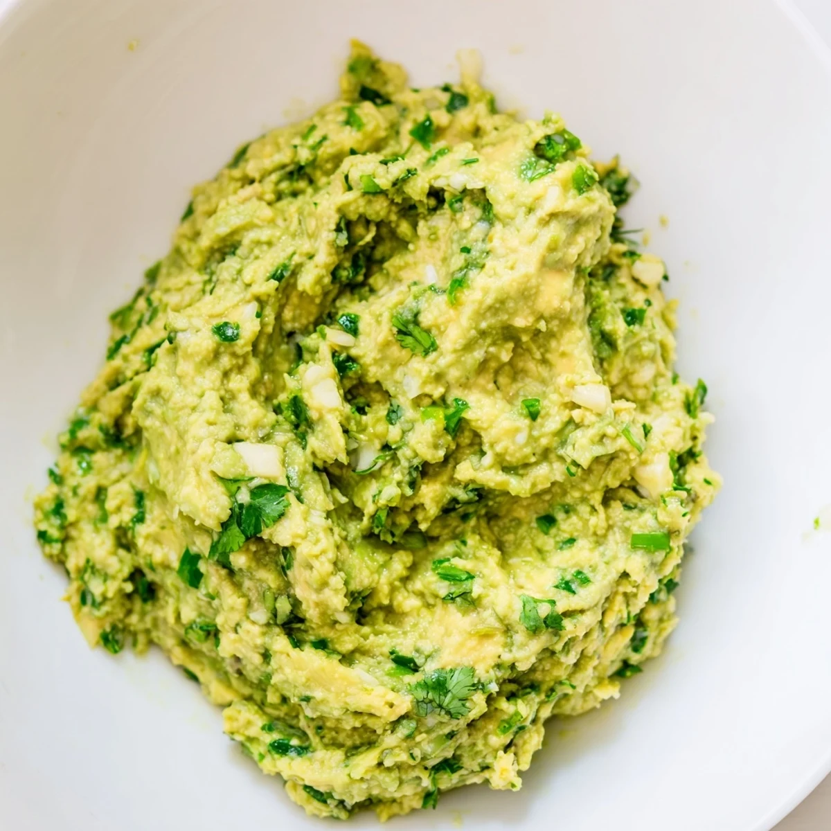 Creamy, vibrant avocado lime dip, perfect for dipping tortilla chips or crudités with friends.