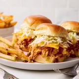 Juicy BBQ chicken sliders stacked with cheddar and crunchy coleslaw, served with crispy fries.  