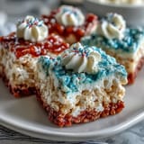Festive red, white, and blue Rice Krispies treats stacked in patriotic layers for a chewy Fourth of July dessert.