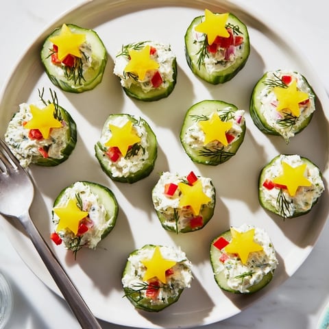 Bright, festive Holiday Star Cucumber Bites, garnished with colorful bell peppers for a delicious appetizer.