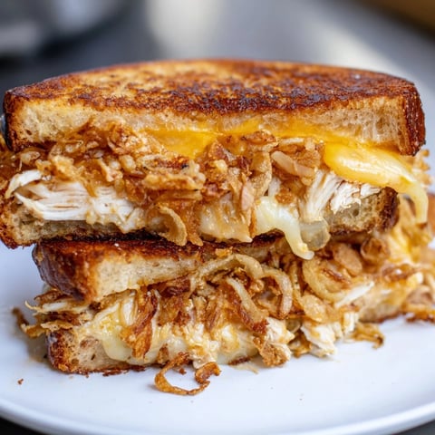 Golden-brown Crispy Shallot Chicken Grilled Cheese sandwich with melted cheese, ready to eat.