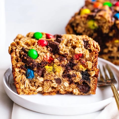 Golden-brown Cinnamon Sugar Monster Cookie Loaf drizzled with melting chocolate chips.  