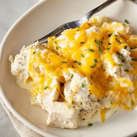 Savory Cheddar Ranch Chicken Bake, golden and bubbly, perfect for family-style meals.  