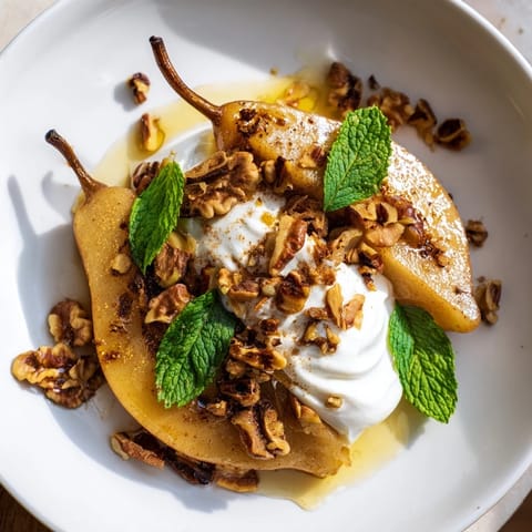 Sweet, tender roasted pears with cinnamon beautifully served atop creamy Greek yogurt and walnuts.