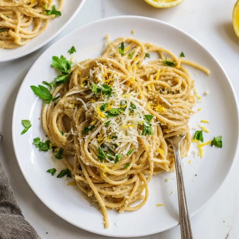 Creamy Roasted Cauliflower Garlic Pasta swirled with herbs, ready for a comforting vegetarian dinner.
