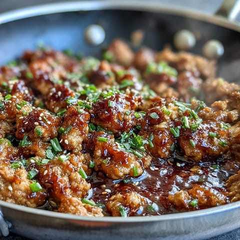 A serving of Korean-Style Ground Turkey over fluffy steamed rice with steamed broccoli, ready for a busy weeknight dinner.