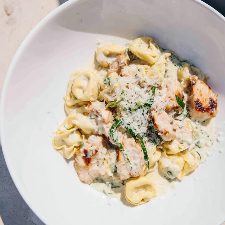 This delicious Creamy Chicken and Spinach Tortellini features a savory, creamy sauce over pasta.