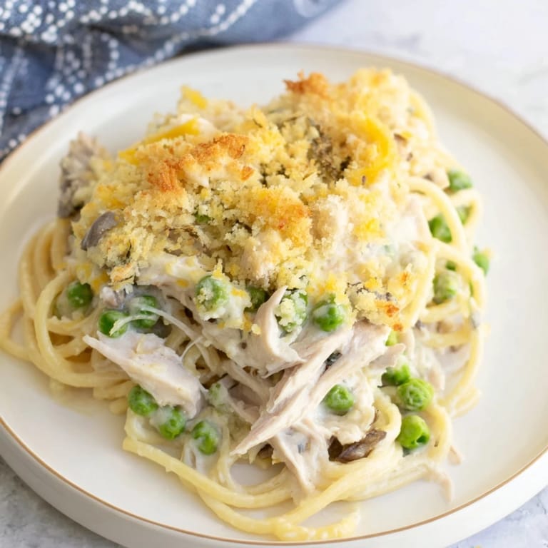 Warm, comforting image of a freshly baked Turkey or Chicken Tetrazzini, ready to serve and enjoy.